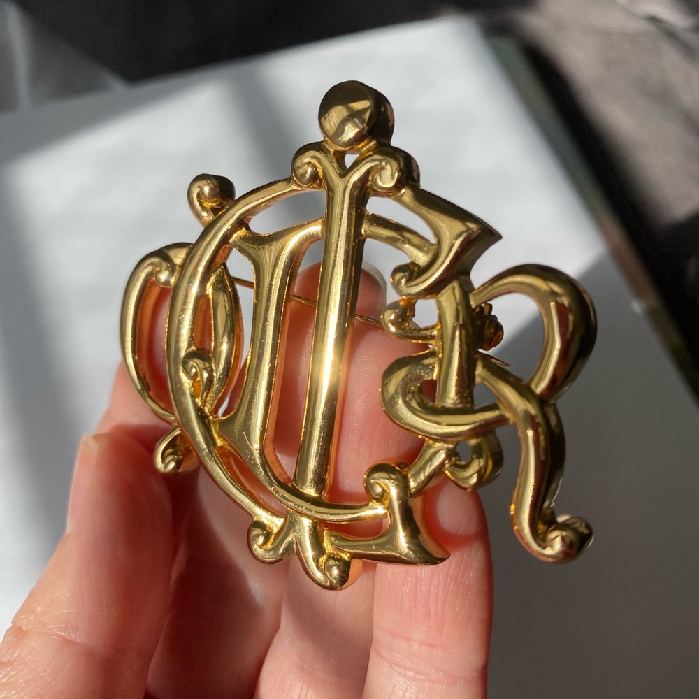 Christian Dior vintage gold tone monogram Brooch.